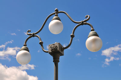 Low angle view of street light against sky