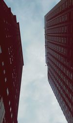 Low angle view of building against cloudy sky