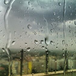 Close-up of water drops on glass window