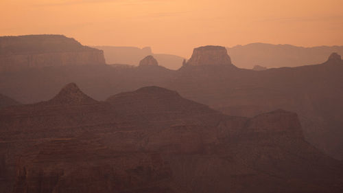 Scenic view of mountains against sky during sunset