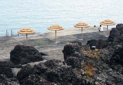 High angle view of man sitting at beach