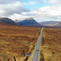 Scenic view of landscape and mountains against sky