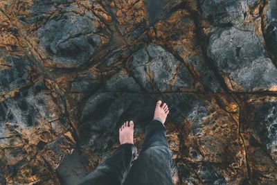 Full length of woman standing on rock