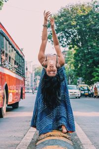 Full length of woman on street in city