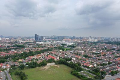 High angle view of buildings in city against sky