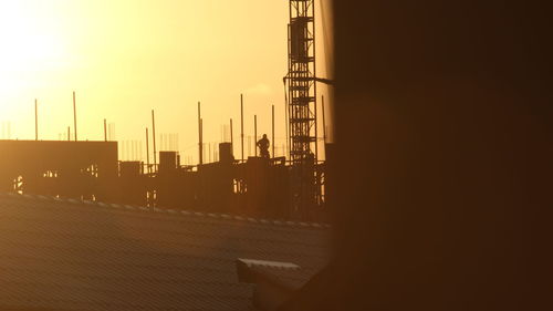 Silhouette of bridge against sky during sunset