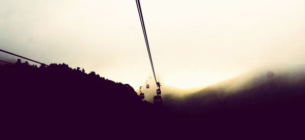 Scenic view of mountains against sky at sunset