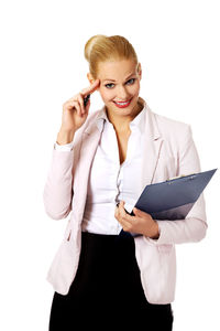 Young woman smiling against white background