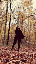 Man standing in forest during autumn