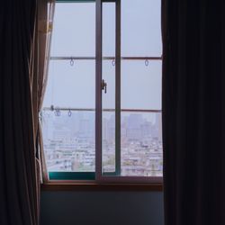 Reflection of sky seen through window at home