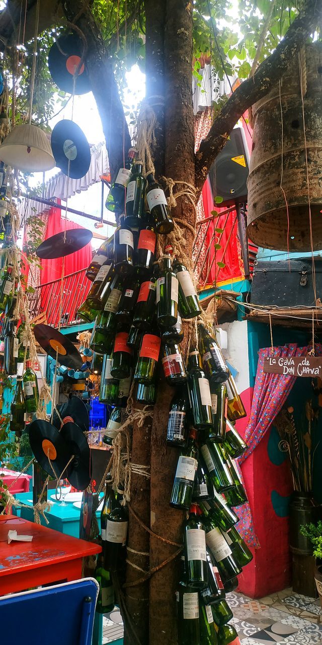 hanging, multi colored, choice, no people, large group of objects, day, variation, market, for sale, clothing, retail, built structure, architecture, low angle view, outdoors, market stall, small business, business, decoration, abundance, sale, retail display, street market