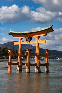 Gazebo on sea against sky