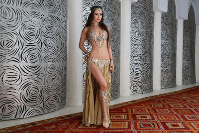 Woman standing against wall