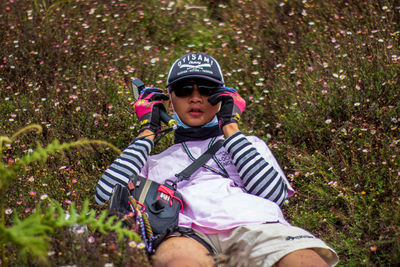 Full length of boy wearing hat against plants