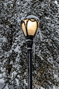 Low angle view of street light on snow