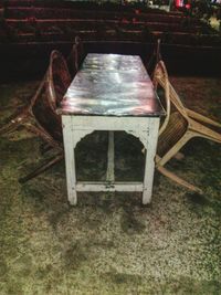 High angle view of empty bench on table in park