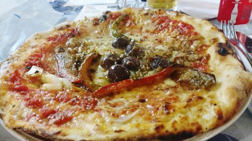 Close-up of pizza served on table