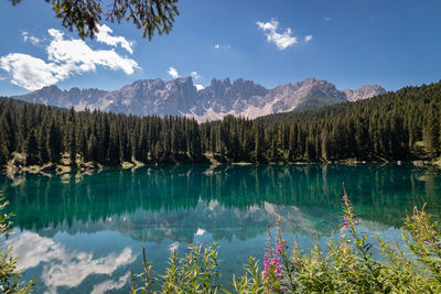 Panoramic view of carezza lake and mountains against sky