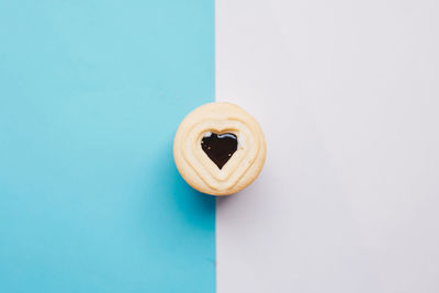 Directly above shot of drink on table against blue background