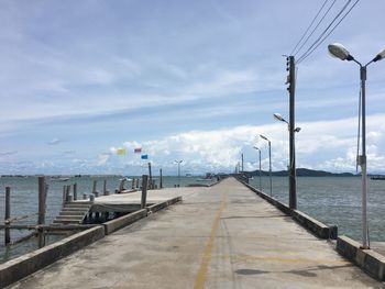 Street by sea against sky