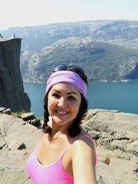 Portrait of smiling young woman in mountains