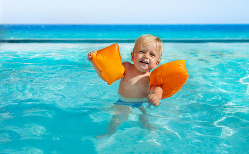 Portrait of boy swimming in sea