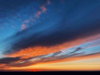 Low angle view of dramatic sky during sunset