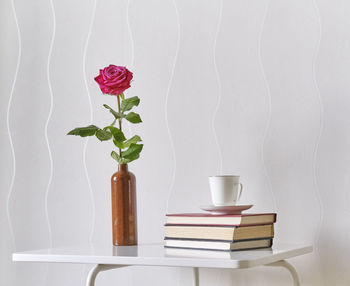 Close-up of roses in vase on table