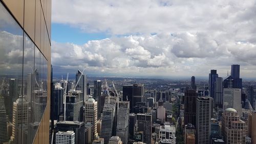 Modern buildings in city against sky