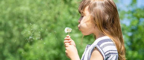 Young woman blowing bubbles