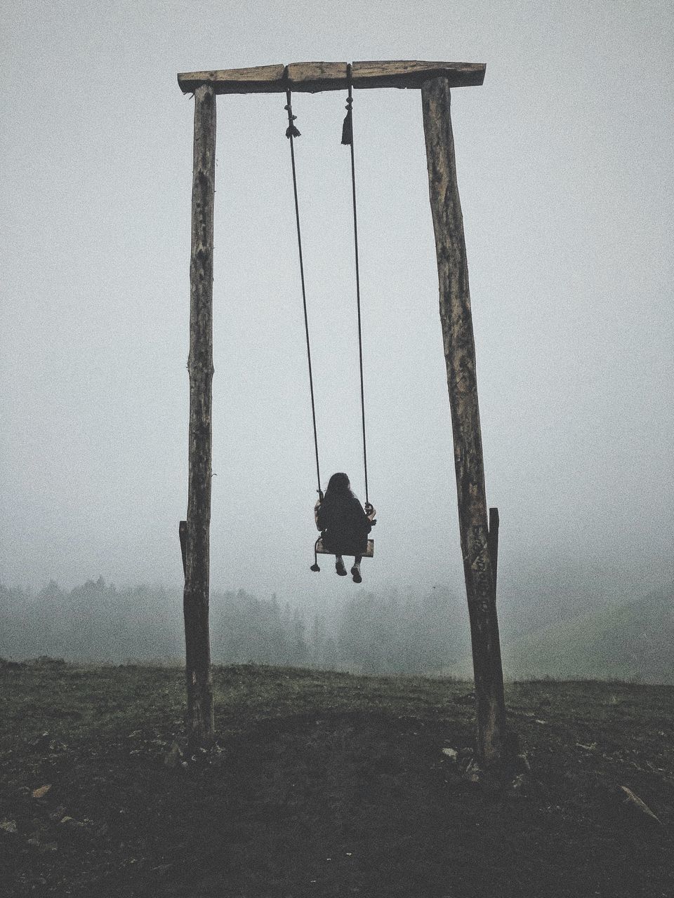 real people, sky, fog, one person, nature, land, day, full length, lifestyles, leisure activity, landscape, outdoors, field, men, hanging, environment, silhouette