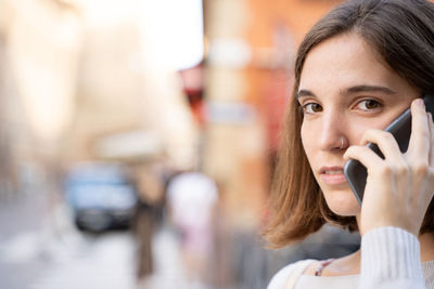 Portrait of woman using smart phone outdoors