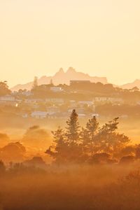 Scenic view of mountains against sky during sunset