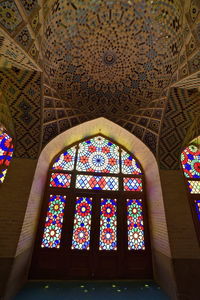 Low angle view of stained glass window in temple