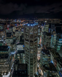 High angle view of illuminated buildings in city at night