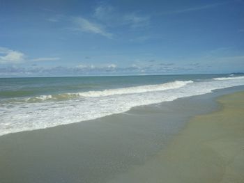 Scenic view of beach against sky