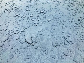 Macro shot of water drops on metal surface