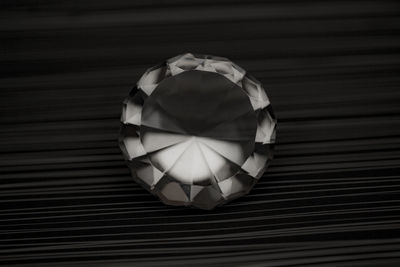 Close-up of diamond on striped table