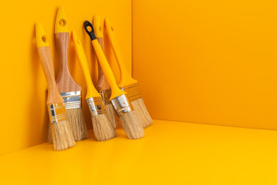 Group of paint brushes tool with yellow copy space