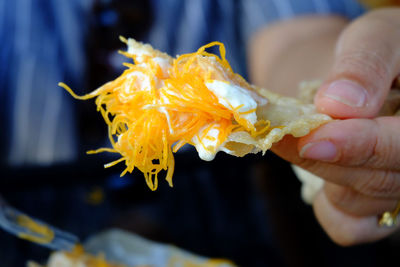 Close-up of person holding ice cream