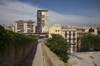 Buildings in city against sky