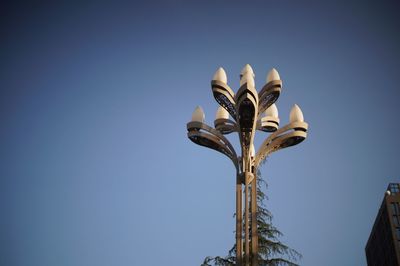 Low angle view of street light against clear blue sky