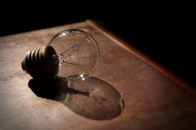 High angle view of light bulb on table