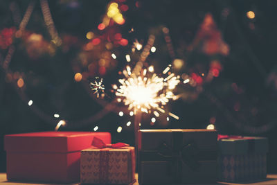 Close-up of christmas presents at night