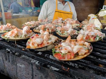 Food on barbecue grill at market