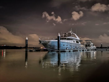 Ship moored in sea against sky