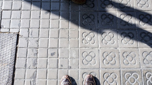 Low section of man standing on floor