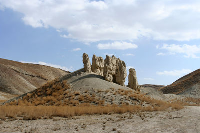 Rock formations in desert against sky