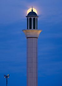 Low angle view of tower against blue sky