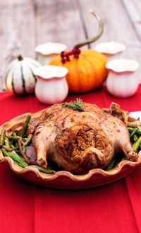 Close-up duck meat served in plate on table